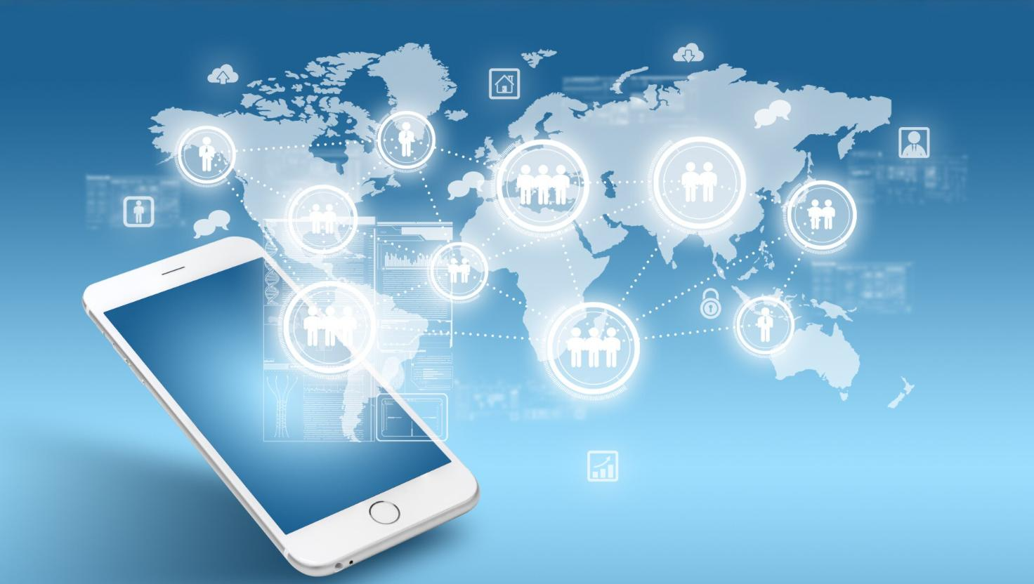 A digital illustration of a smartphone in the foreground with a glowing world map in the background, connected by icons representing people and cloud-based services. The image conveys the global reach of scalable communication, highlighting advancements in modern telecom tools and office phone systems that support seamless phone system upgrades.